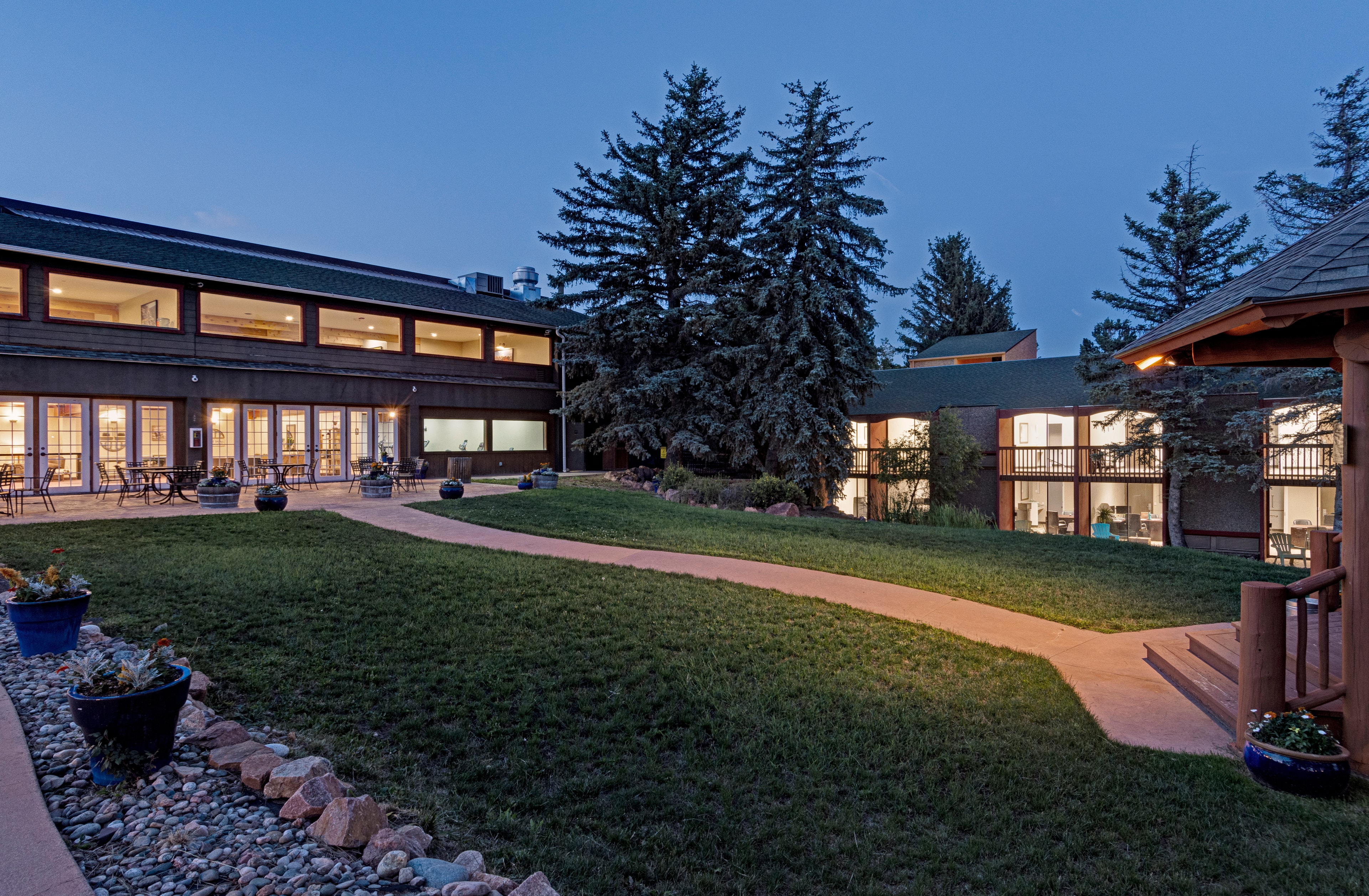 Mountain Springs Recovery campus courtyard and buildings at dusk